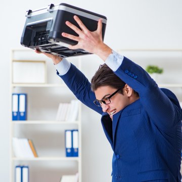 Man tired of old fax machine